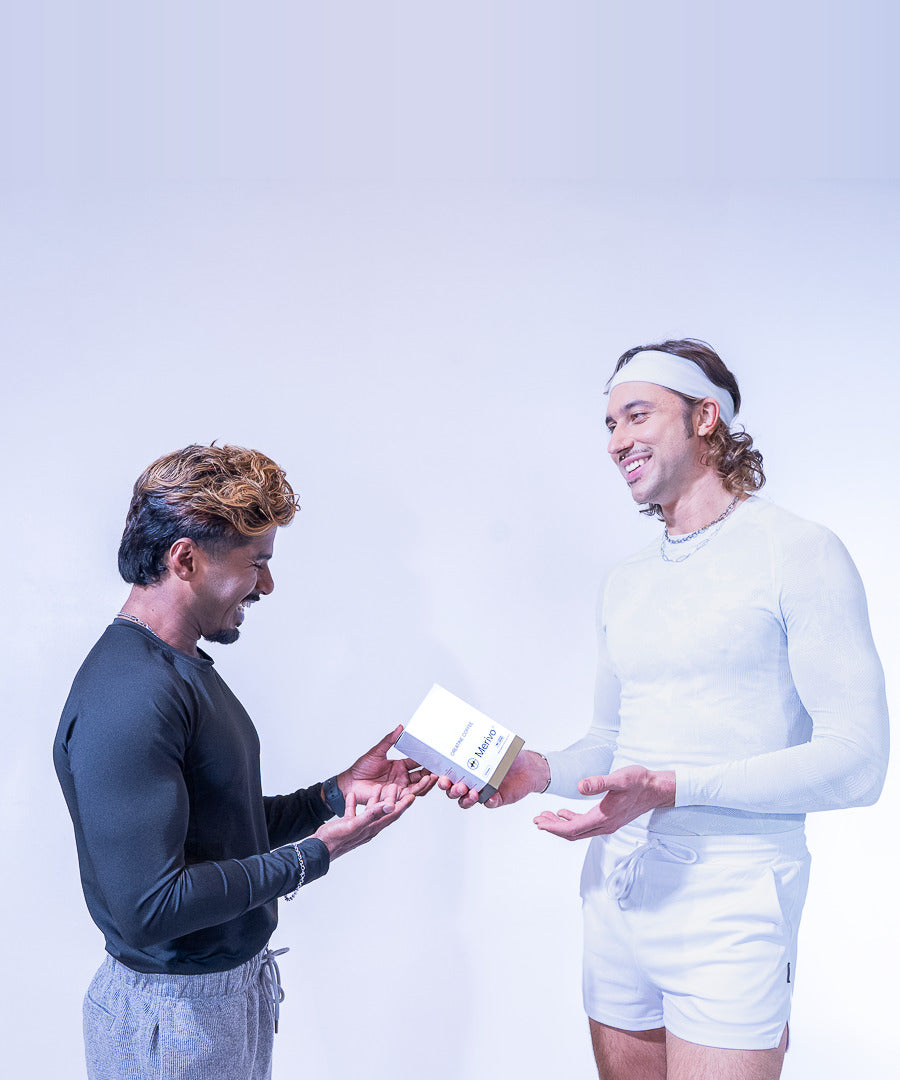 One athlete handing a box of Merivo Creatine Coffee to another.